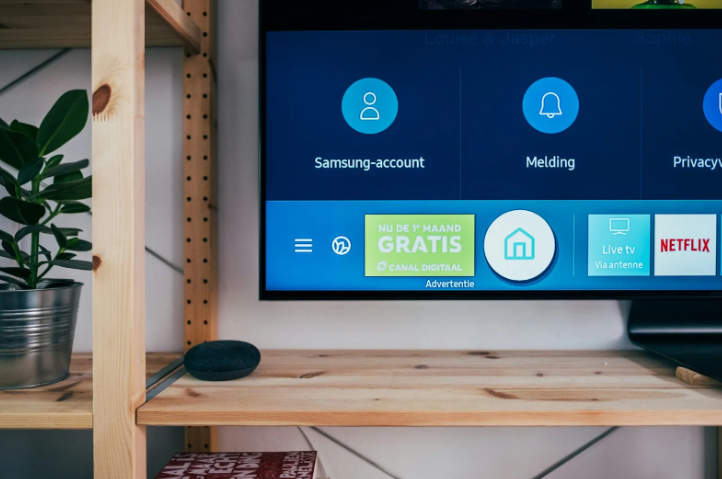 black flat screen tv on brown wooden tv rack