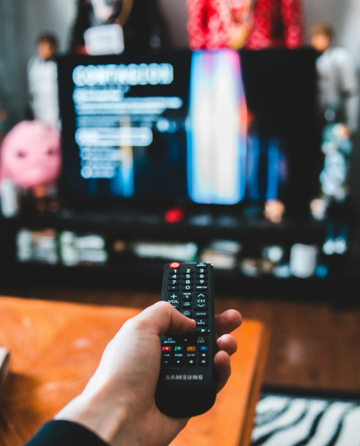 person holding black remote